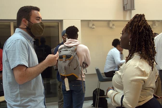 Two people talking at a networking event