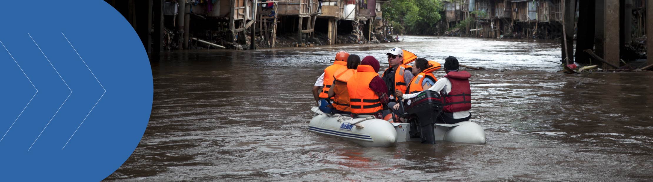 Citizens of Jakarta in a boat due to floods in the city.